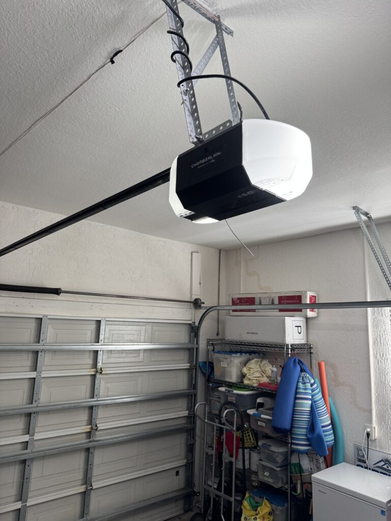 Garage door stuck partially open with ceiling mounted opener in Ocala Florida home